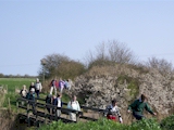The group cross a footbridge over the Boy Grift Drain.