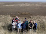 The group atop a high sand dune near the Paradise car park which gave us fine views out across the marshland to the sea.